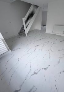 Tile effect LVT flooring installed in a new build property by Koti Homes