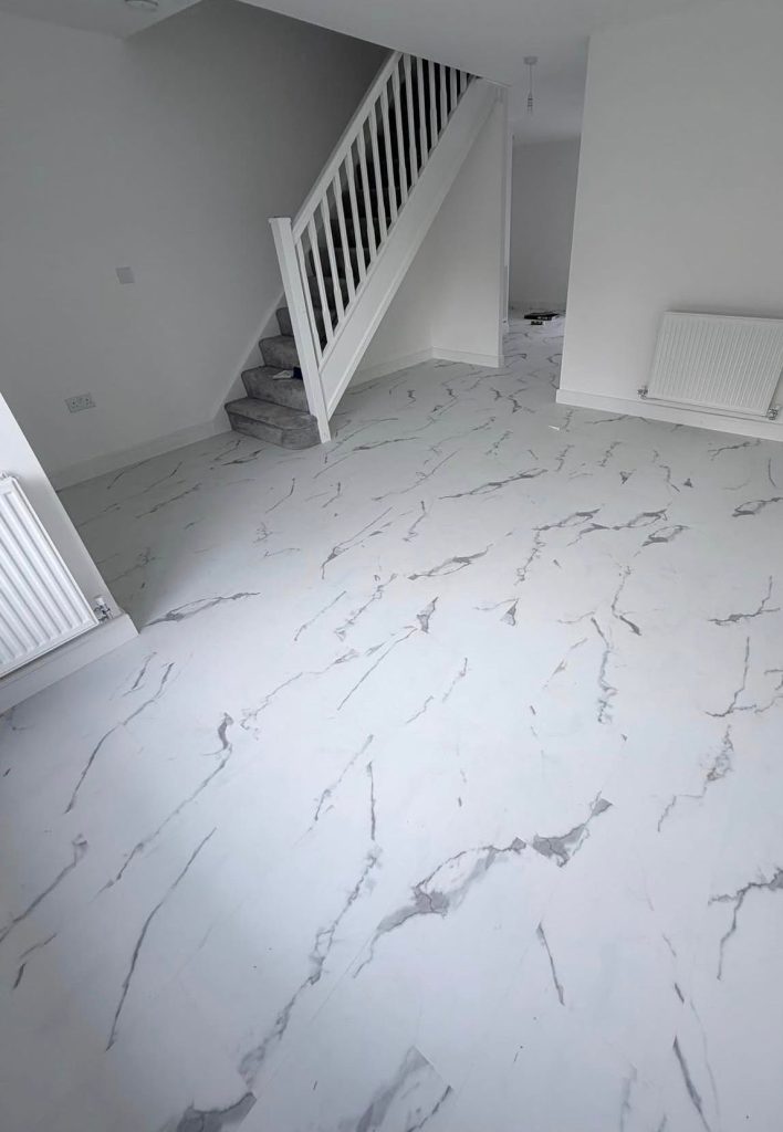 Tile effect LVT flooring installed in a new build property by Koti Homes